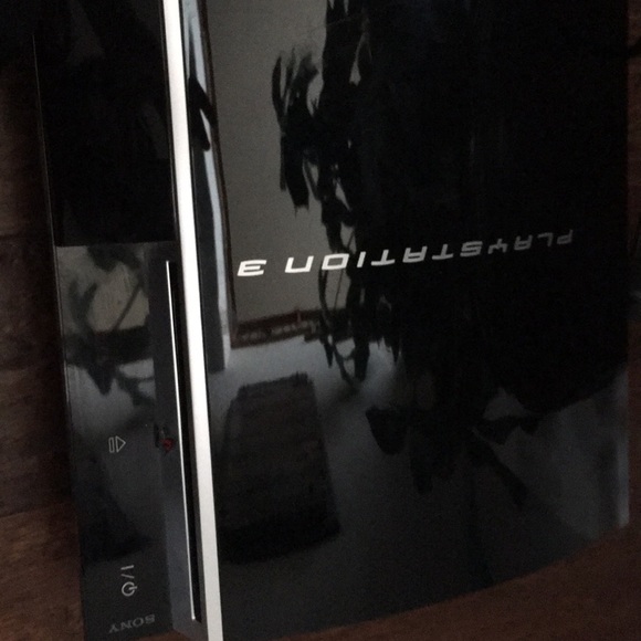 A PlayStation 3 and controller with all the cords. - Picture 2 of 6